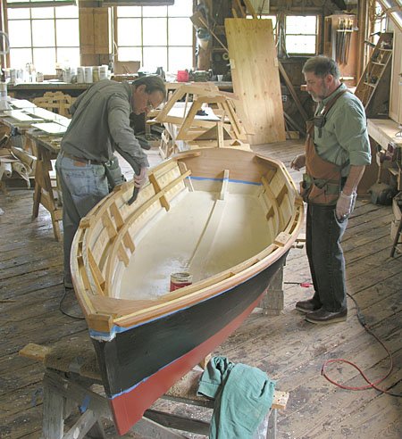Craftsmen working on a small boat