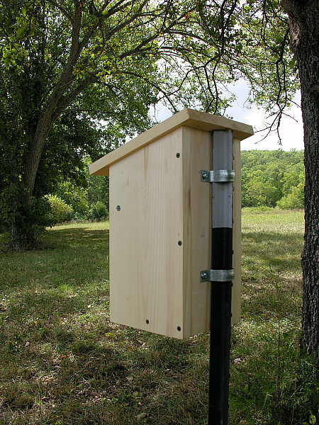 Nesting box attached to t-post with conduit straps