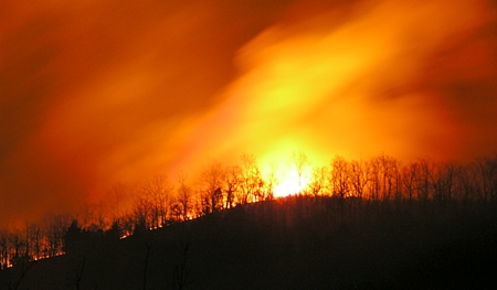 Blaze threatens new log home