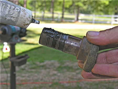 Anti-sieze compound used on retaining bolt