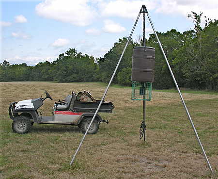 Tripod feeder with hoist assembly